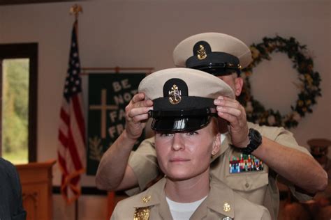 Cpo pinning 2022 - 211119-N-KK394-1286 NAVAL STATION MAYPORT, Fla. (Nov. 19, 2021) Chief Information Systems Technician Tranette Harding marches through sideboys during a chief petty officer pinning ceremony held at ...